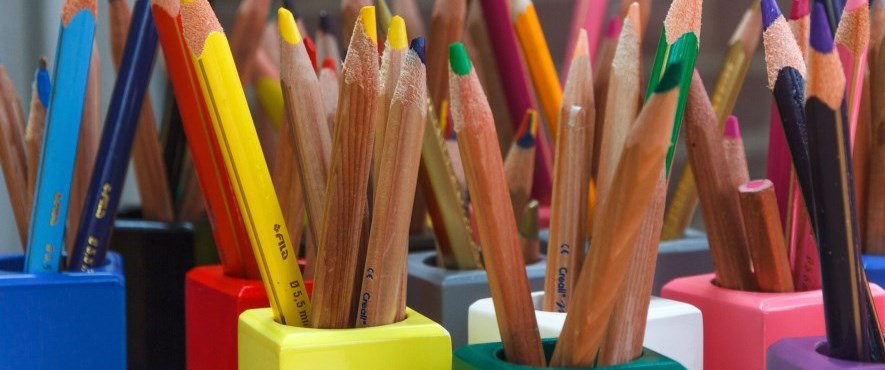 colourful pencil crayons with tips facing upward
