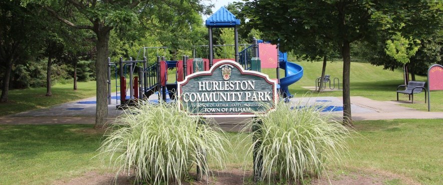 park sign in front of out door park and play structure